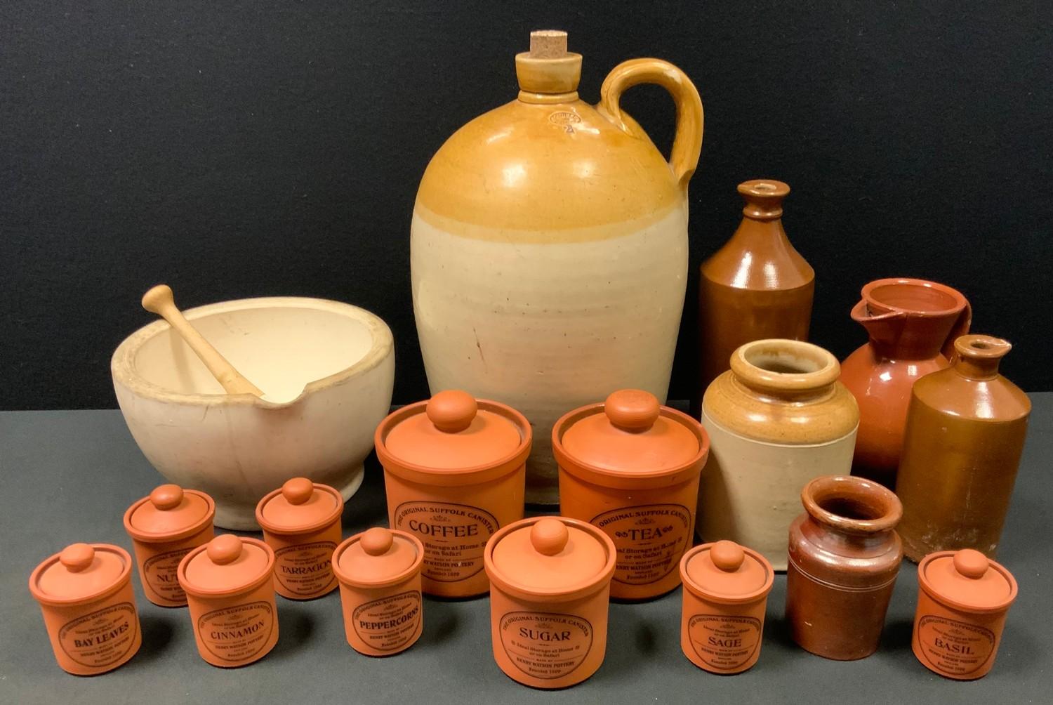 A large pestle and mortar, Powell of Bristol 2 gallon flagon, terracotta kitchen storage jars etc