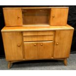 A mid 20th century Nathan teak sideboard, sliding glass doors flanked by cupboards to the detachable