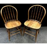 A pair of bentwood hoop back dining chairs, spindle back, oak saddle seat, turned legs and
