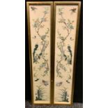 A pair of Chinese embroidered sleeve panels embroidered with birds and insect amongst flowering