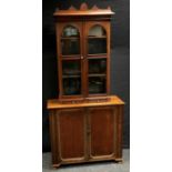 A Victorian mahogany and stained pine bookcase top, shaped pediment, two arched glazed doors over