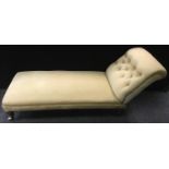 A Victorian chaise, button upholstered scrolling back, turned legs, ceramic casters. 75cm high x