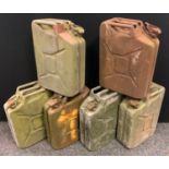 A vintage metal jerry can; others, four stamped with broad arrow, one with ?Combatgas F-46?