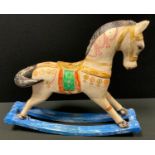A miniature painted wooden rocking horse, decorated in the Persian taste, blue rails, 44cm x 54cm