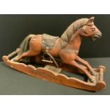 Folk Art - a miniature carver wooden Rocking Horse, shaped cradle, saddle 26cm high, overall 37cm