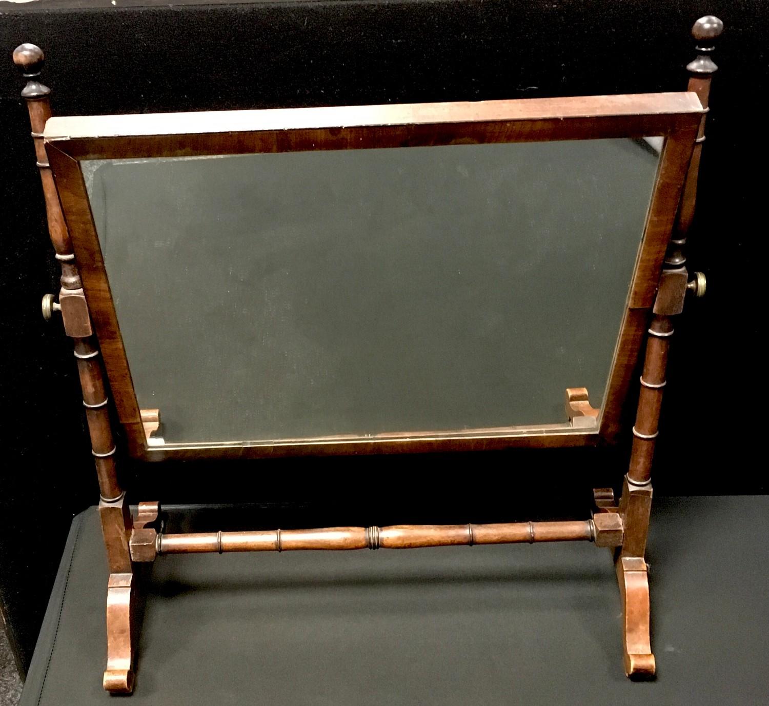 A George III mahogany dressing mirror, rectangular plate, turned uprights. 55cm high x 50cm wide.