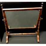 A George III mahogany dressing mirror, rectangular plate, turned uprights. 55cm high x 50cm wide.