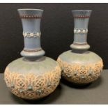 A pair of Doulton Lambeth Siliconware vases, molded with a lattice and floral band, impressed marks,