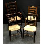 An early 19th century oak spindle back carver, rush seat; a similar, later dining chair; to