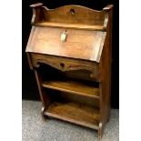 An Arts and Crafts oak student?s bureau.