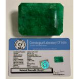 Loose Gemstones - a certified rectangular step cut emerald, measuring 57mm x 42mm x 28mm, 560ct,