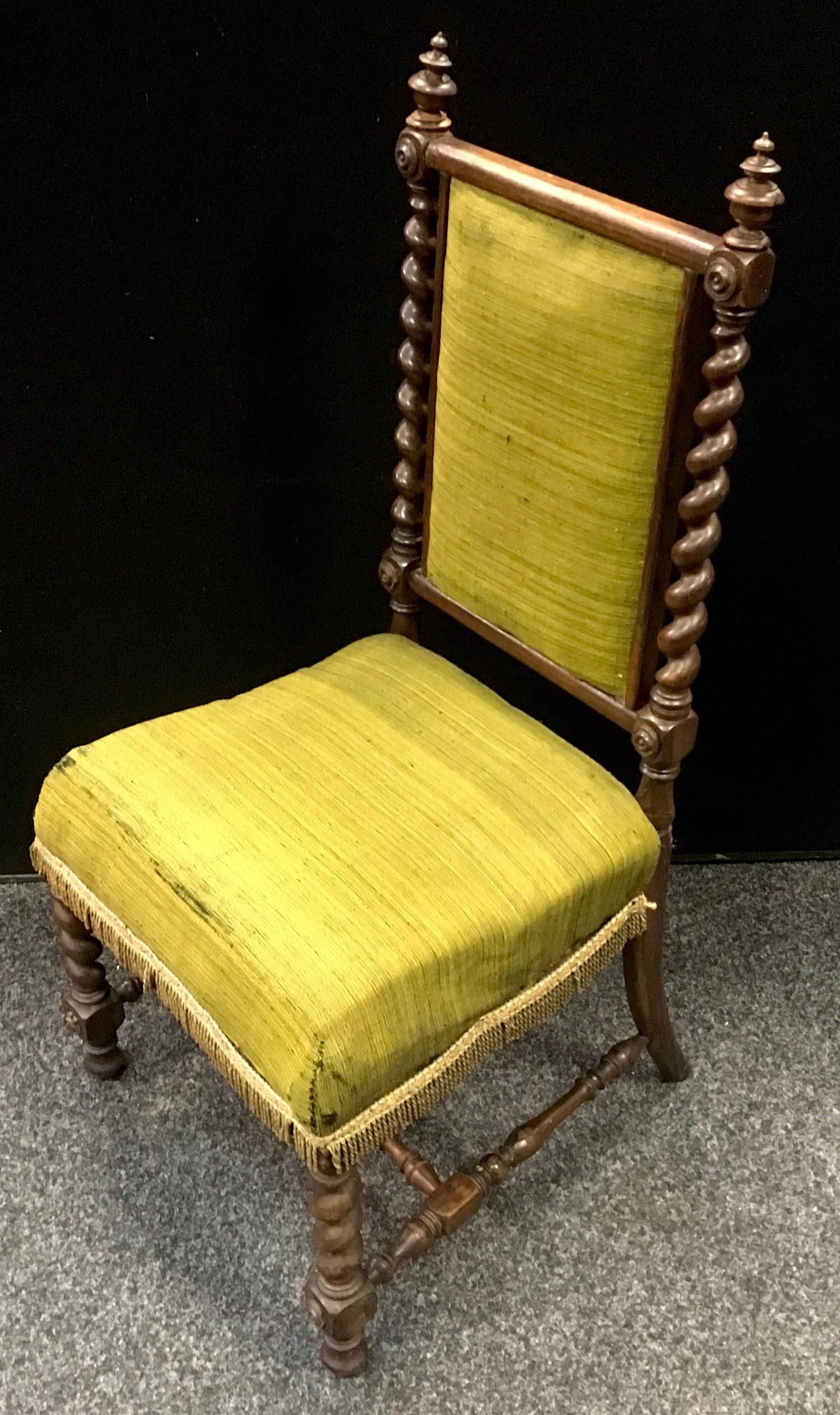 A Victorian rosewood salon chair, turn finials to barley twist uprights, padded back and seat,