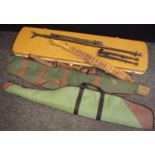 A leather cartridge belt; two gun cases; hard gun case; stands; etc