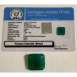 Loose Gemstones - a certified rectangular step cut deep green emerald, 27.80ct, GLI gem testing