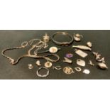 Jewellery - a silver coloured metal spring bangle, white metal pendants, articulated fish etc