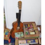 A Tatra Classic guitar; Treble Plus tennis racket; toddlers stroller and blocks; Collins children