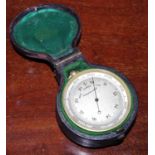A 19th lacquered brass combination barometer and thermometer, the double-sided drum enclosing both