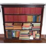 A late 19th century mahogany open bookcase, blind carved frieze three adjustable shelves, double