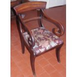 A Regency mahogany elbow chair, with curved oversailing cresting rail, downswept shepherds crook