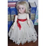 A German bisque head doll, for the French market, sleeping blue eyes, open mouth, dimple to chin,