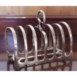 An Edwardian silver seven-bar toast rack, axehead handle, 12cm long, Suckling Ltd, Chester 1901, 4.