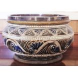 A Royal Doulton bowl, designed by GTH, in relief and incised with undulating beaded line with floral