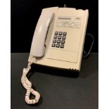 A retro Solitaire 1100 pay phone.