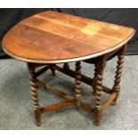 An oak barley twist drop leaf table, oval moulded top. 73cm high x 91cm wide x 42cm opening to