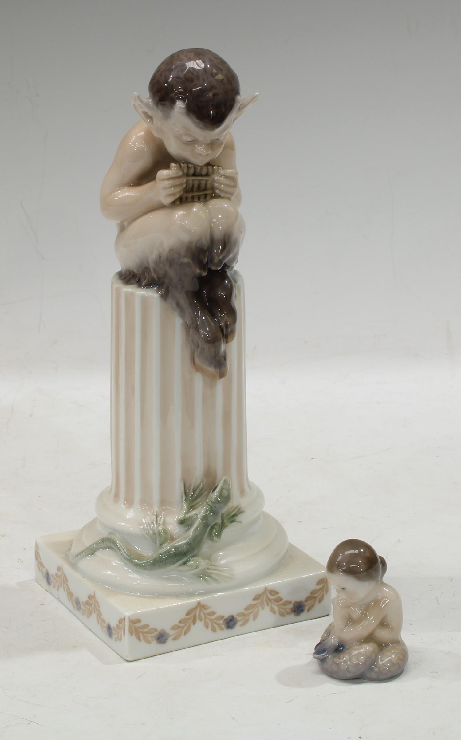 A Royal Copenhagen model of Pan perched atop a column, 20cm, printed marks; a Royal Copenhagen