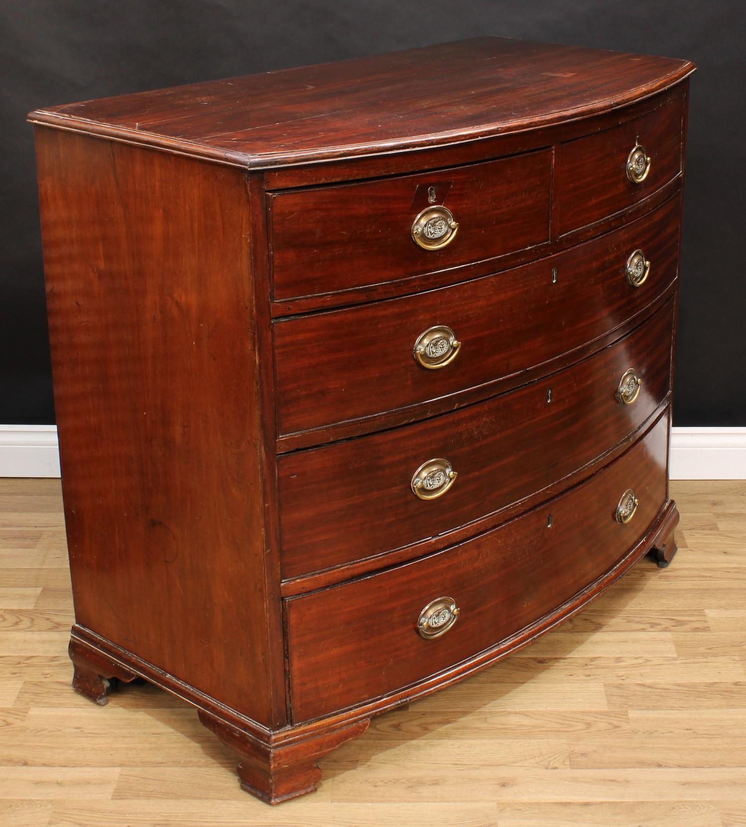 A Regency mahogany bow-front chest, slightly oversailing top with moulded edge above two short and - Image 2 of 4