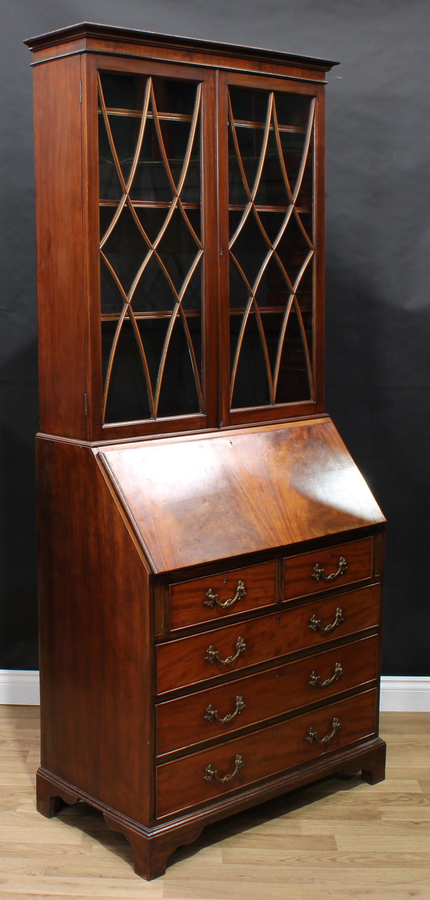 A George III Revival mahogany bureau bookcase, shallow outswept cornice above a pair of glazed doors - Image 3 of 5