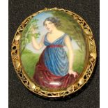 An early 20th century Arts and Crafts 9ct gold mounted enamel brooch, painted with a lady, signed to