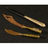 A trench art letter opener; another, similar; a silver plated letter opener (3)