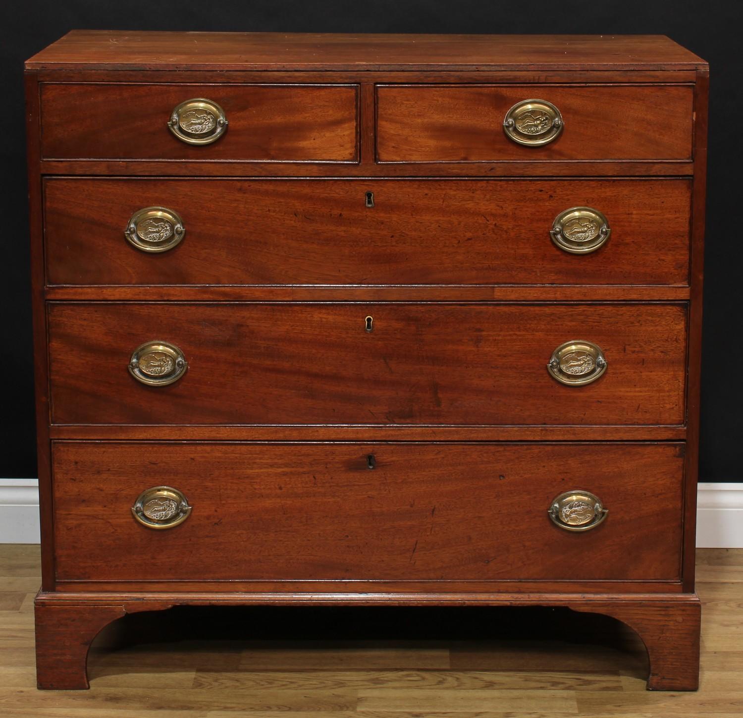 A Regency mahogany chest, flush rectangular top above two short and three long graduated