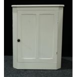 A country cottage white painted corner cupboard, 98cm high, 77.5cm wide, 46cm deep