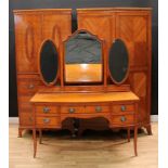 A Waring & Gillow Sheraton Revival satinwood three-piece bedroom suite, comprising a dressing table,