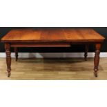 A late Victorian walnut extending dining table, chamfered rectangular top with one additional