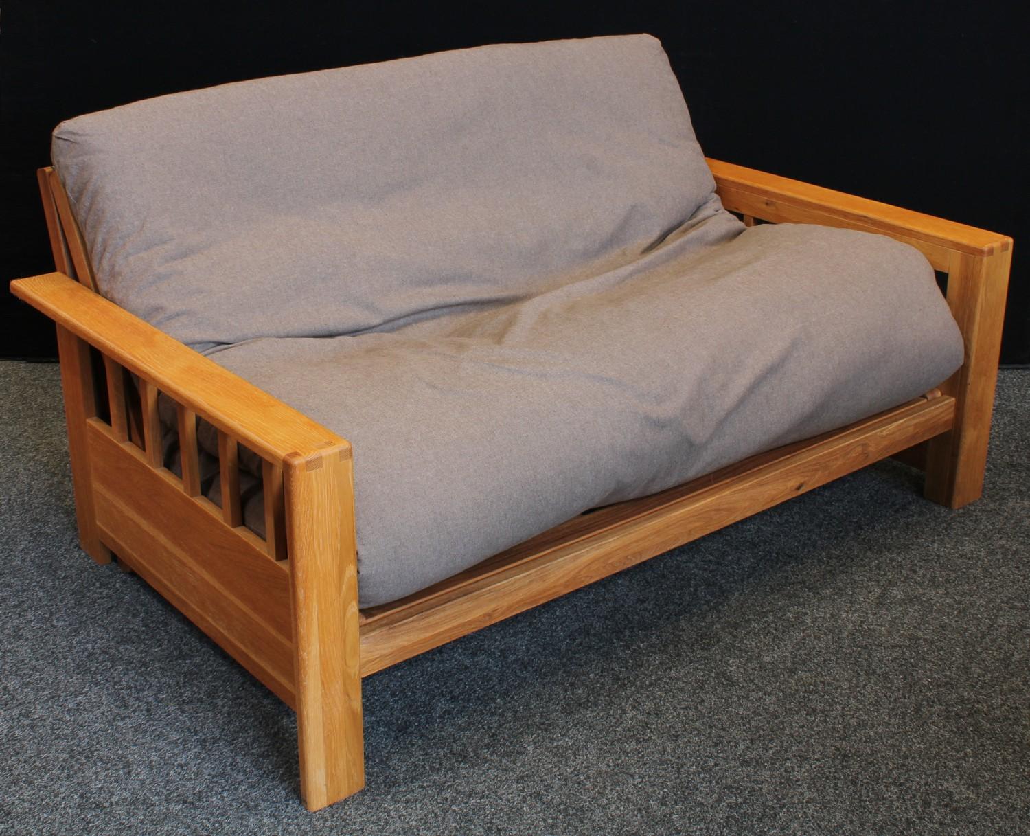 An oak framed sofa bed, Vienna by Futon Company, the frame (in sofa form) 71cm high, 156cm wide, - Image 2 of 6