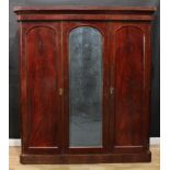 A Victorian mahogany two-door wardrobe, re-purposed from a three-door, outswept cornice above a pair