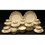 A Royal Crown Derby Melody pattern tea service for twelve comprising two cake plates, side plates,