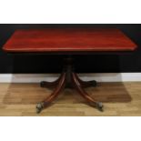 A 'Regency' mahogany breakfast table, rounded rectangular top, turned column, sabre legs, brass lion