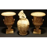 A pair of Bretby campana urns, 32cm high; a Bretby Art Nouveau vase (3)