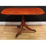 A Regency mahogany breakfast table, crossbanded rounded rectangular tilting top, spreading