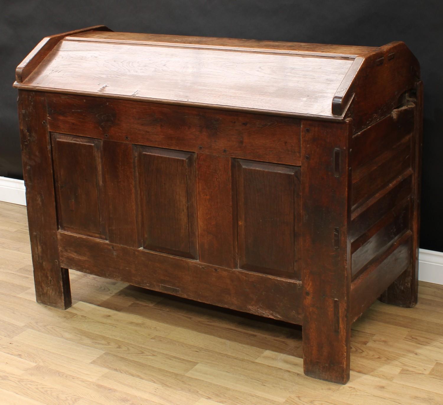 An 18th century oak ark, gabled top, the front with three raised and fielded panels, stile feet, - Image 2 of 3