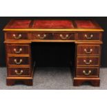 A George III style twin pedestal desk, rectangular top with three inset writing surface above