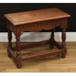 A 17th century style oak joint stool, rectangular top with moulded edge above a nulled frieze,