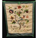 Textiles - a crewel work type wall hanging, embroidered with fanciful birds, deer and insects in a