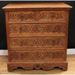 An early 20th century oak chest, moulded rectangular top above two short and three long drawers, the
