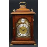A 19th century style mahogany bracket clock, arched dial inscribed Tempus Fugit, Roman and