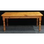 A large pine farmhouse kitchen table